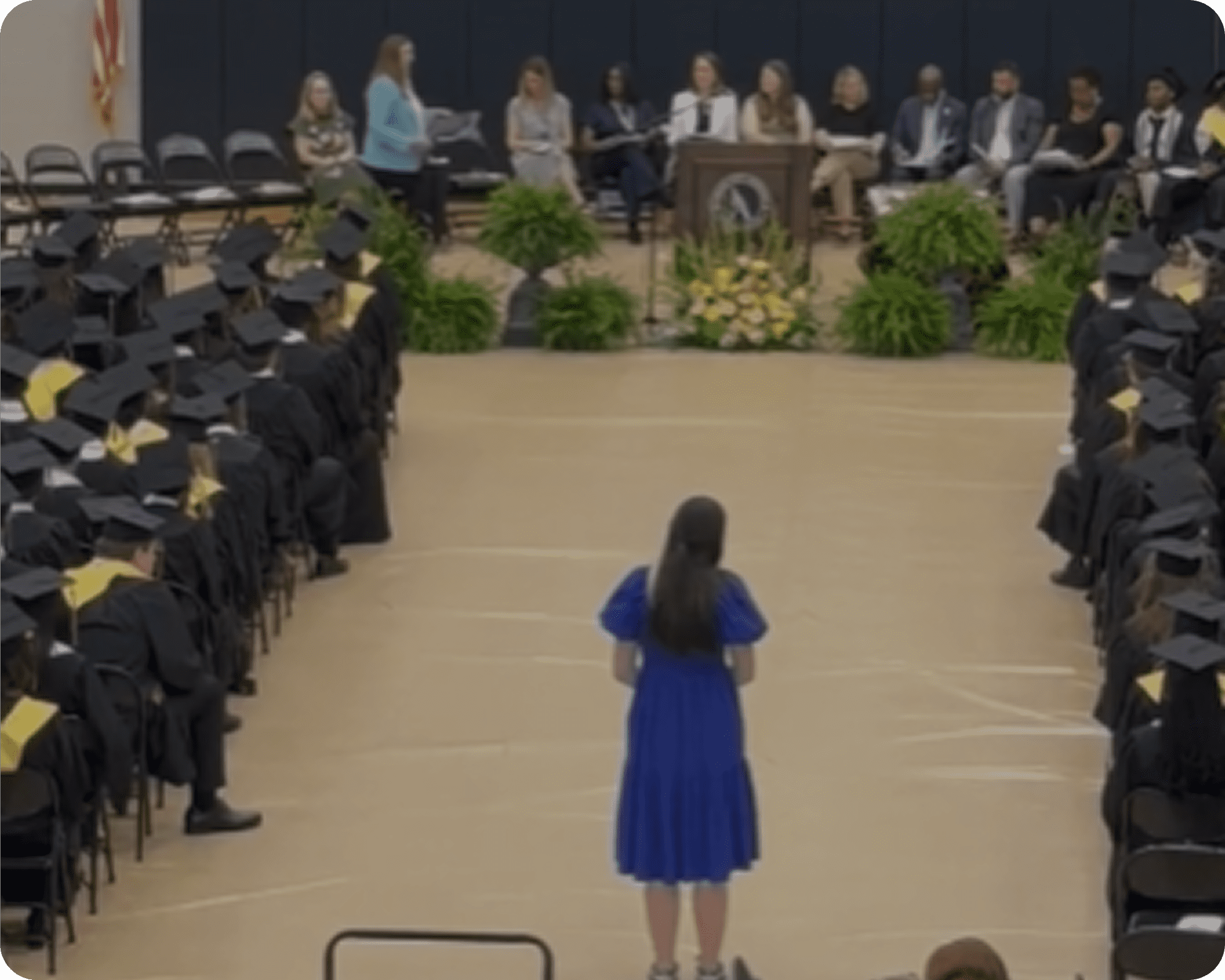 Graduation ceremony with seated graduates
