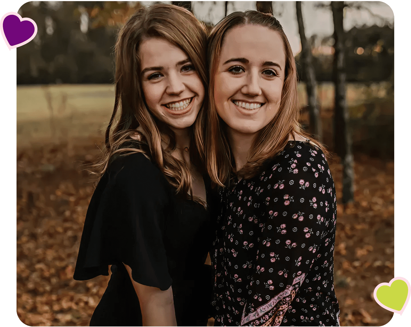 Two friends smiling outdoors in autumn