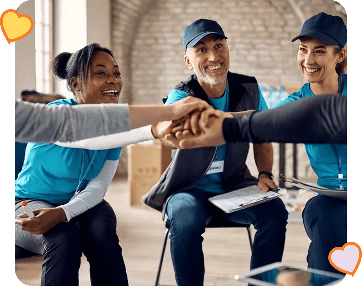 Smiling team members in a group huddle.