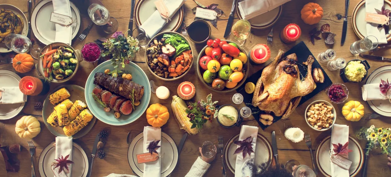 Holiday meal setup with turkey and vegetables
