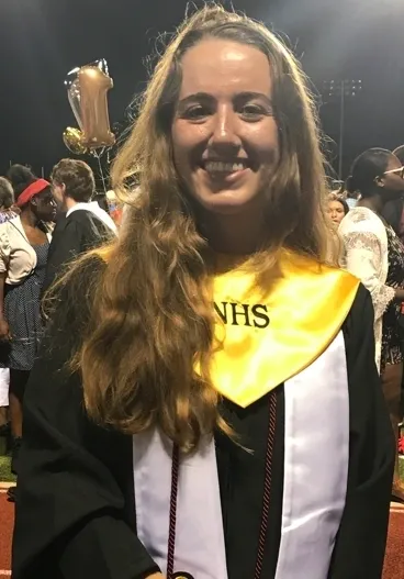 Student celebrating graduation day outdoors