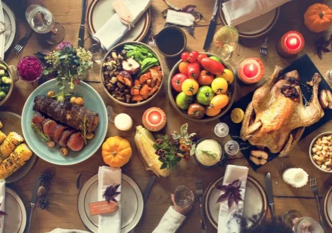 Holiday meal setup with turkey and vegetables