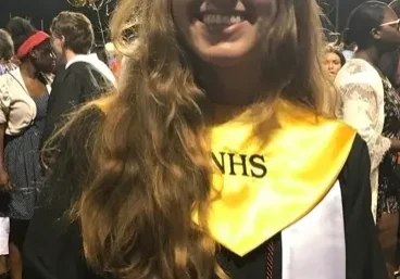 Student celebrating graduation day outdoors